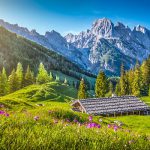 Idyllic landscape in the Alps with mountain chalet in springtime