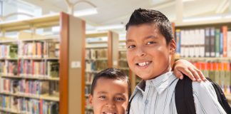 two young boys in library