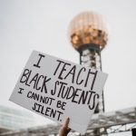 Placard saying" I teach Black students. I CANNOT BE SILENT"