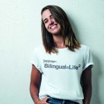 Girl wearing "Bilingual = Life Square" T-shirt