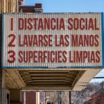 Spanish movie cinema billboard with three rules to avoid the coronavirus epidemic. Translation, wash hands, maintain social distance, clean surfaces